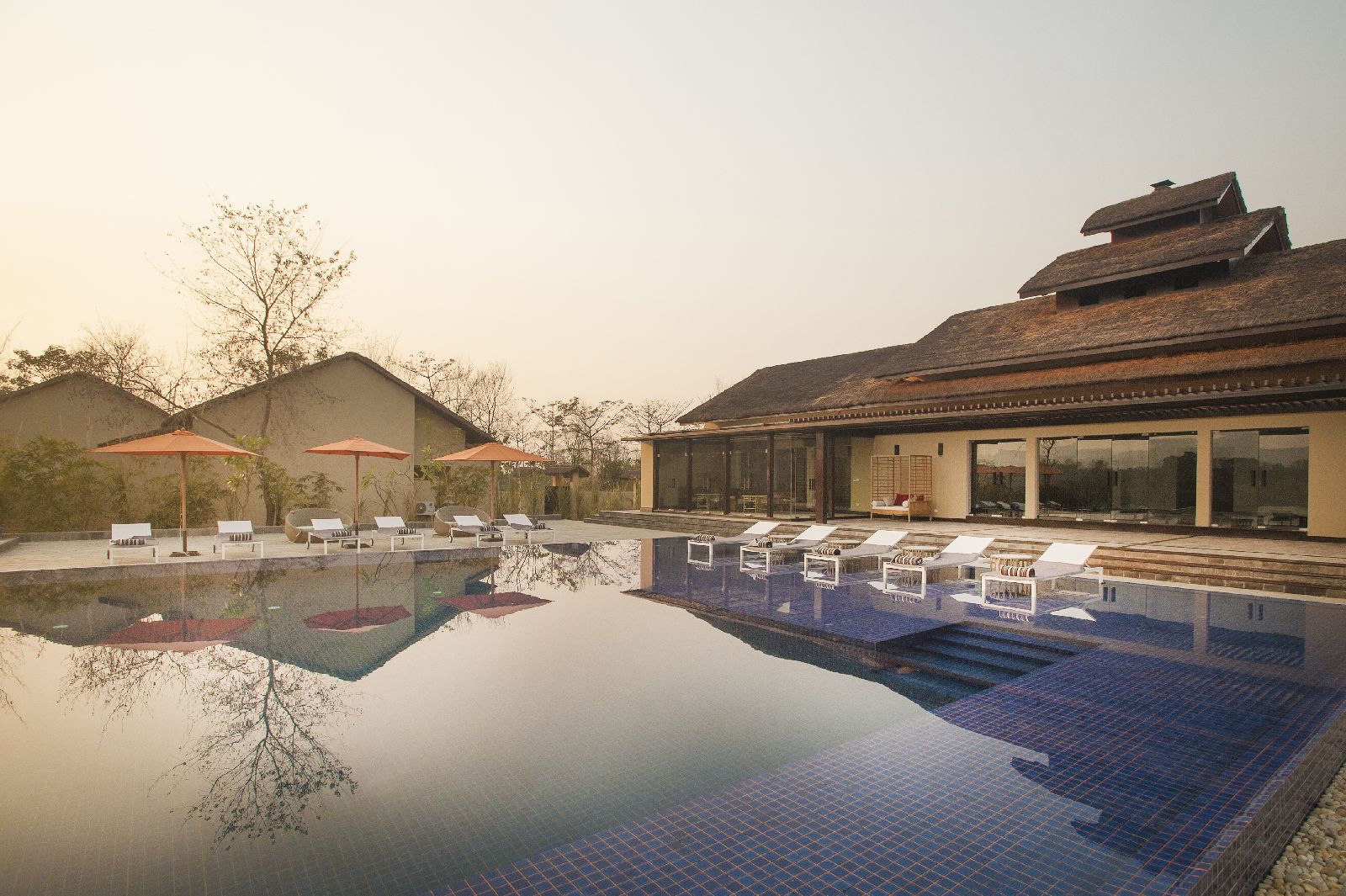 The swimming pool at Meghauli Serai luxury safari camp Nepal