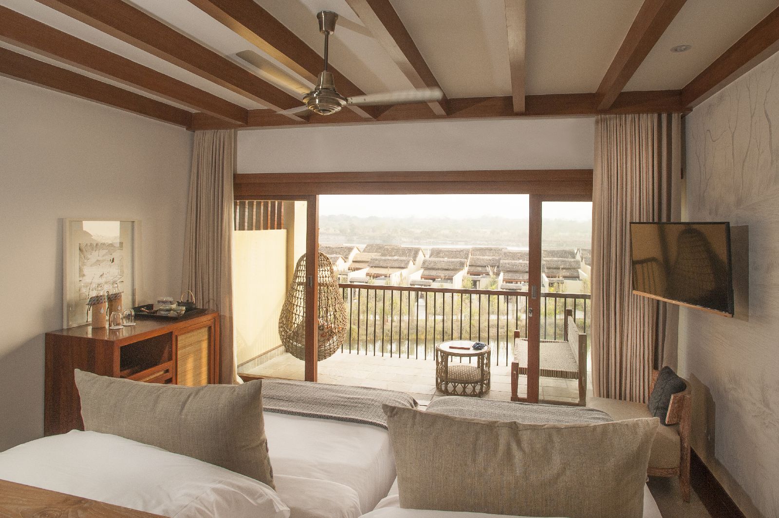 Guest room with balcony at Meghauli Serai luxury safari camp Nepal