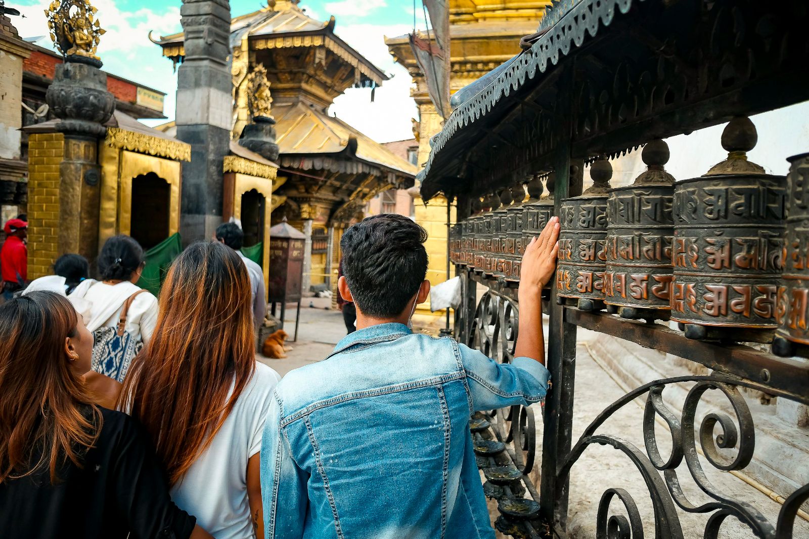 A man spinning a prayer wheel in Nepal
