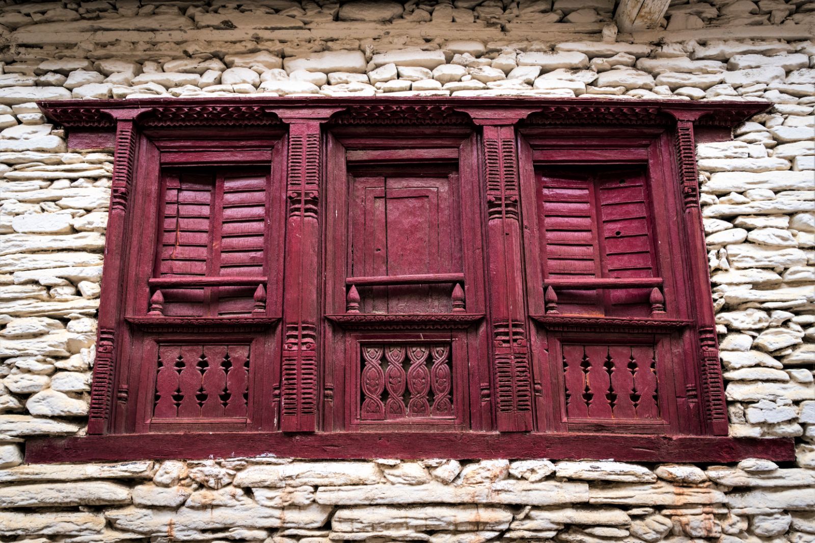 Marpha shutters on the exterior of a building in Nepal's Mustang district