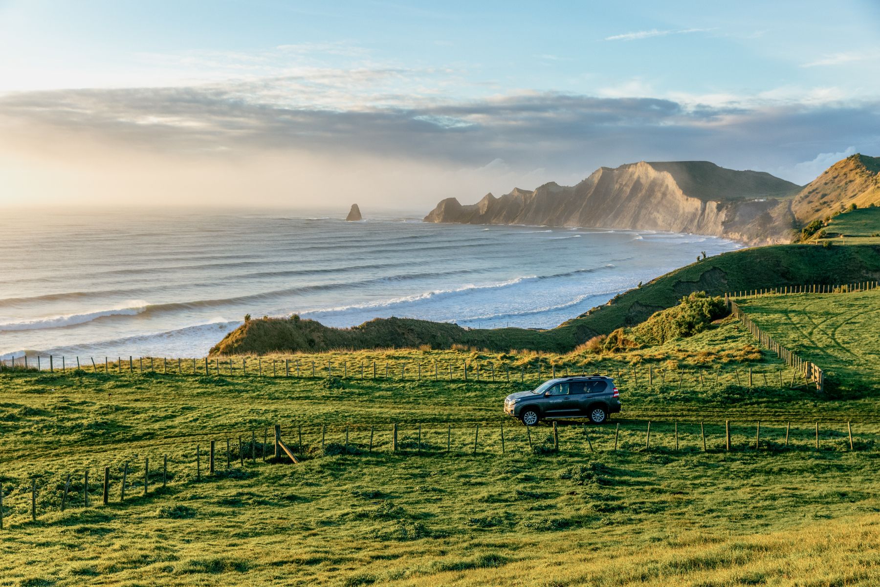 Jeep driving along the coast near Rosewood Cape Kidnappers New Zealand