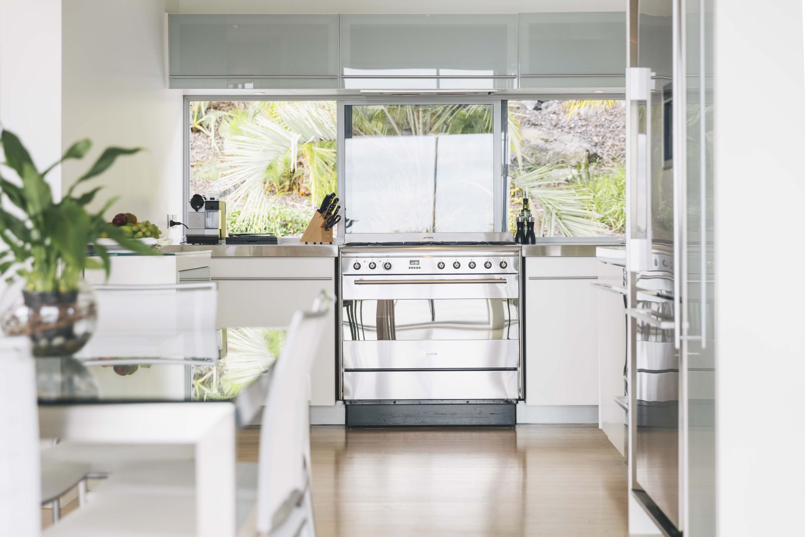 The Eyrie villa New Zealand kitchen with a dining table and plant