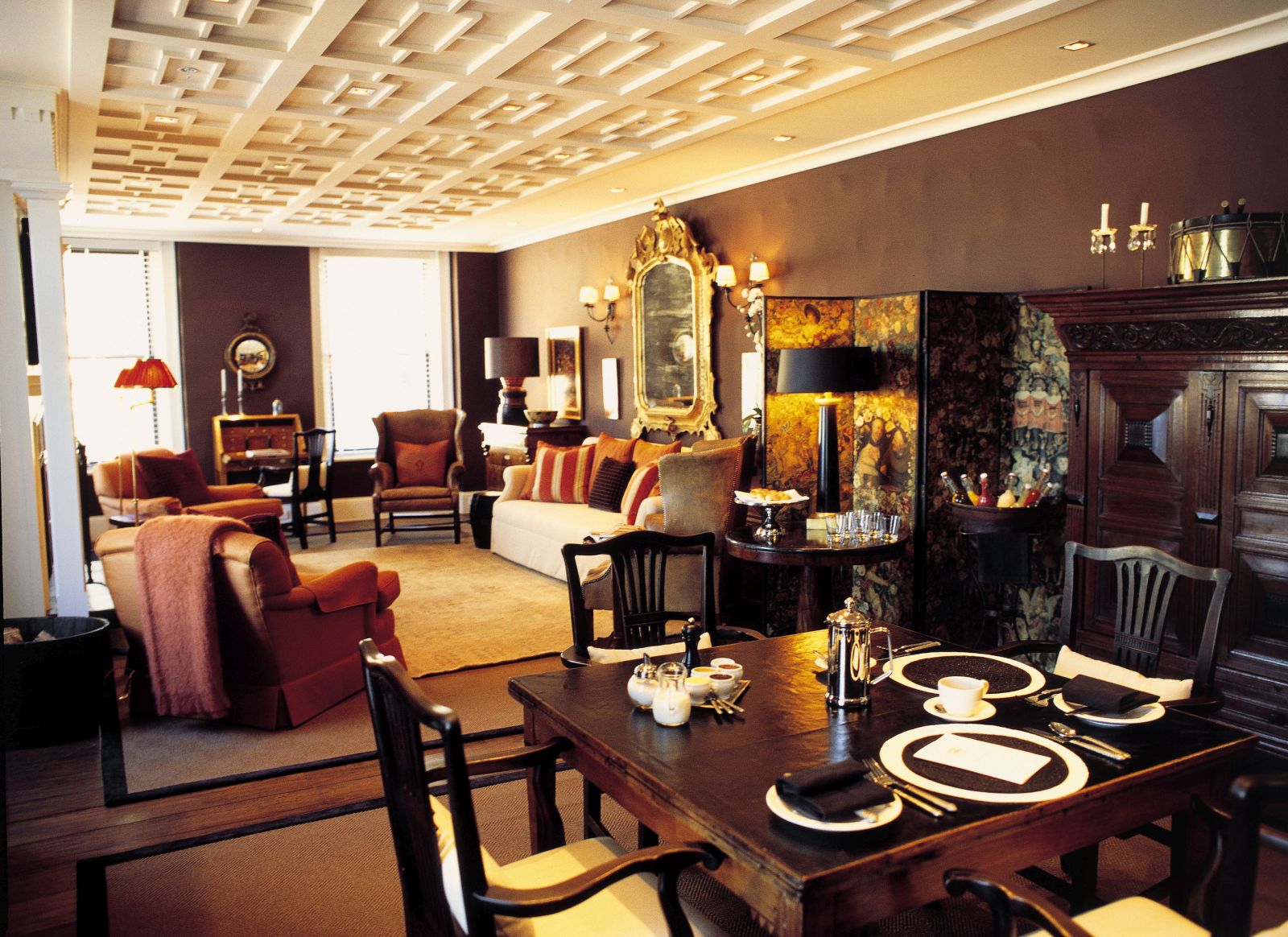Eichardt's Private Hotel New Zealand lounge area with sofas and a dining table