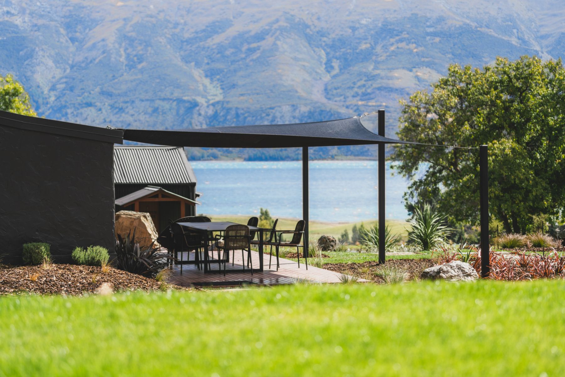 Outdoor dining terrace at Lake Hawea Station, a luxury lodge in New Zealand