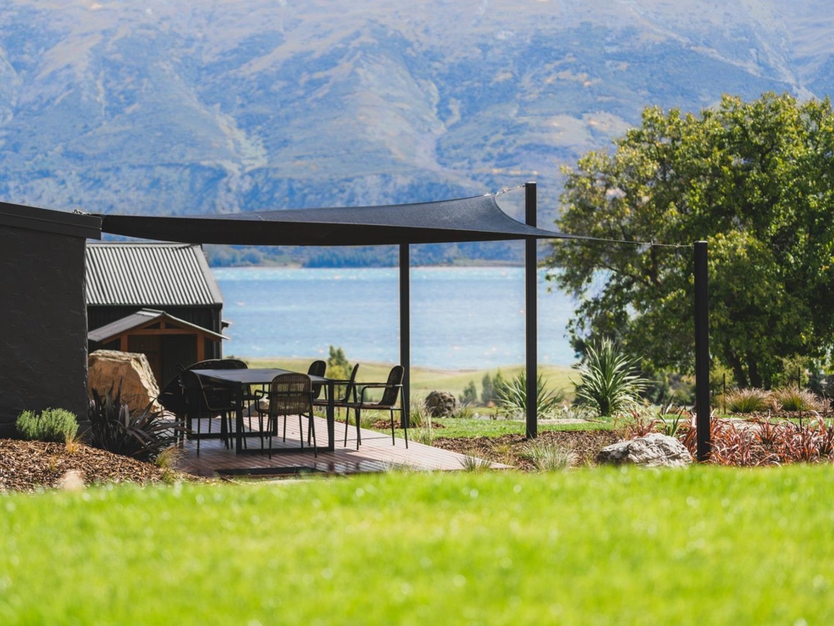 Outdoor dining terrace at Lake Hawea Station, a luxury lodge in New Zealand