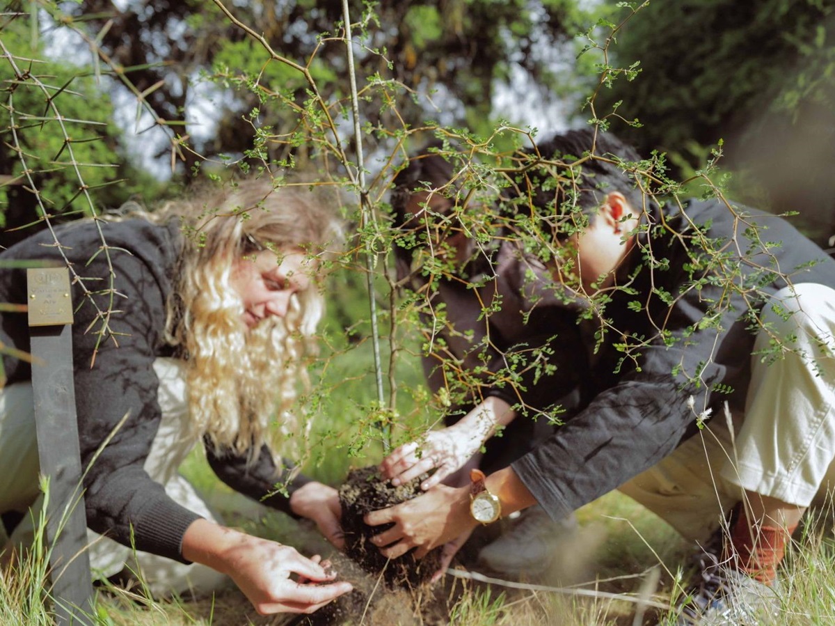 Two people planting a tree at Lake Hawea Station New Zealand