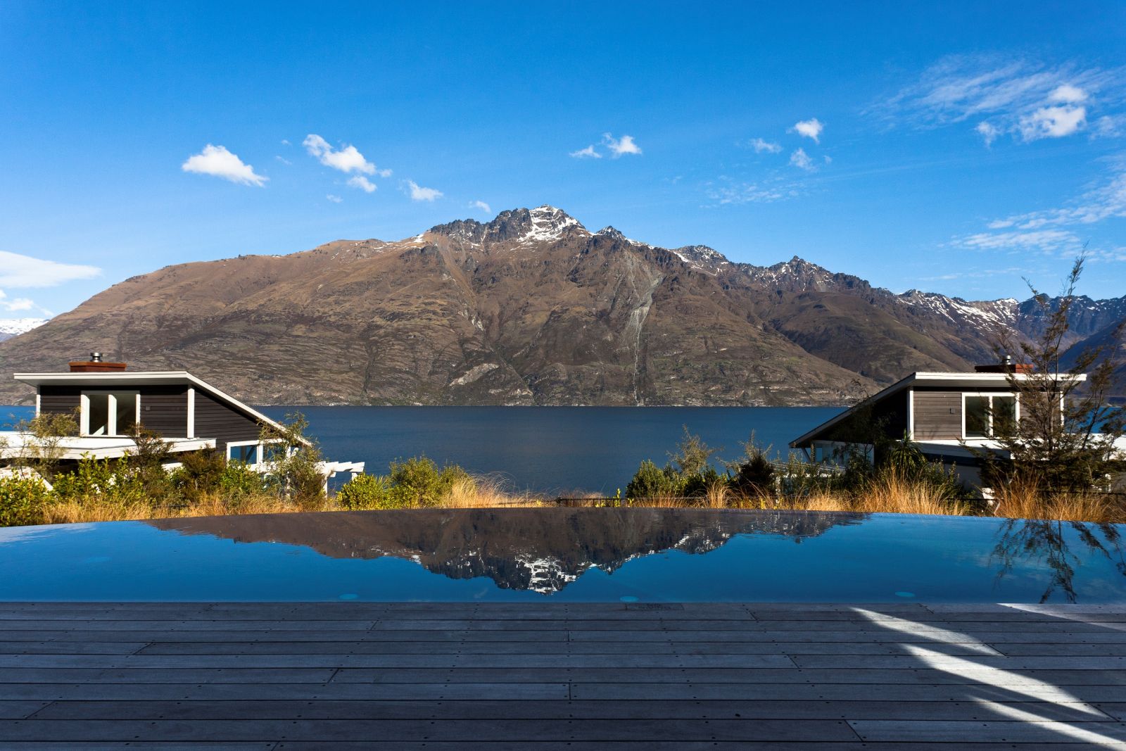 Matakauri Lodge outdoor pool overlooking the lake