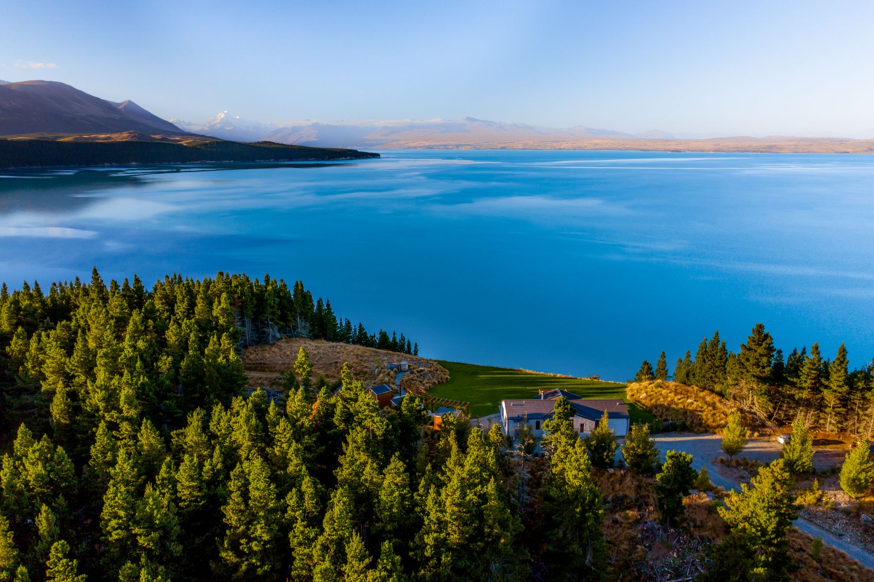An aerial view of Lake Pukaki at Mt Cook Lakeside Retreat, a luxury lodge in New Zealand