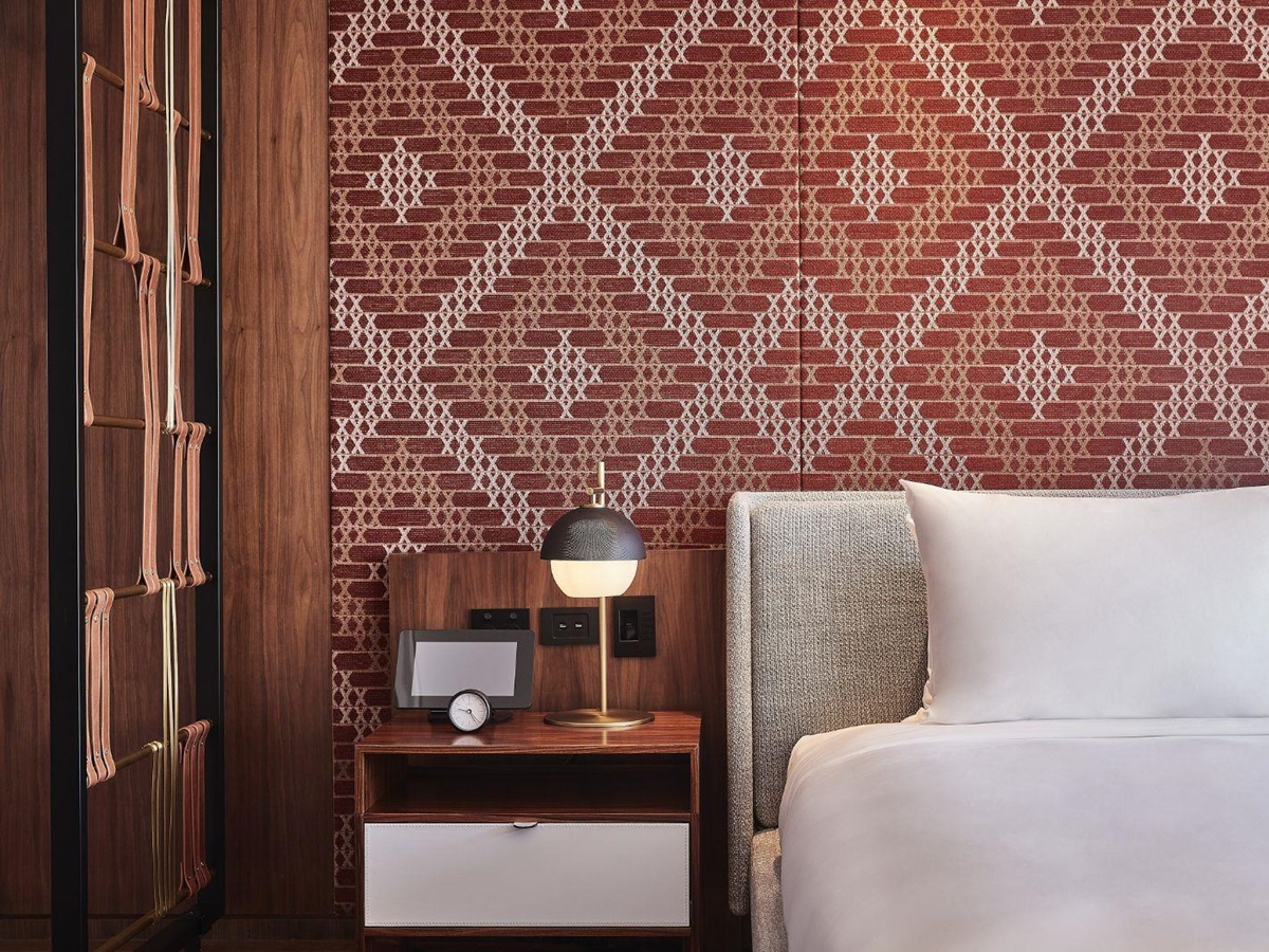 Guest suite bed and bedside table at Park Hyatt Auckland in New Zealand