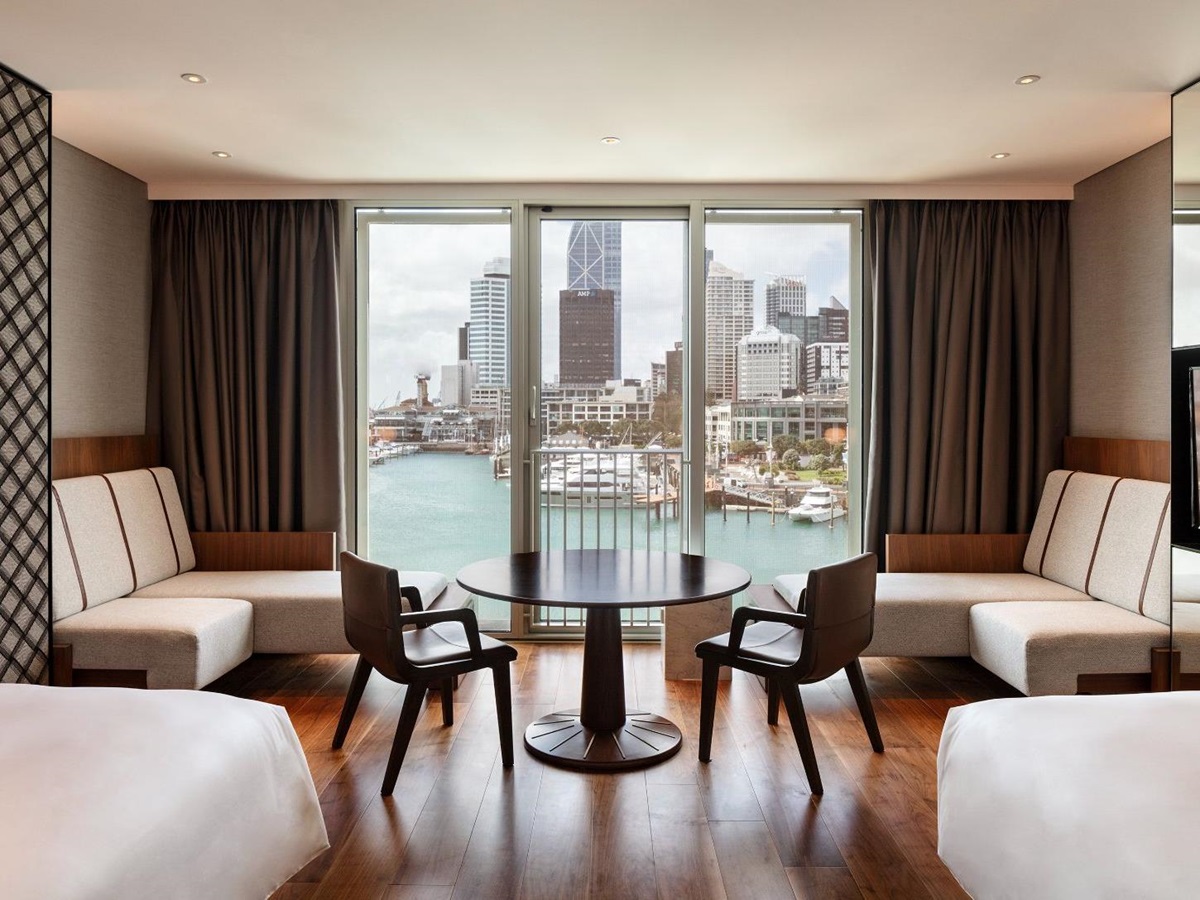 Guest bedroom lounge with city view at Park Hyatt Auckland in New Zealand