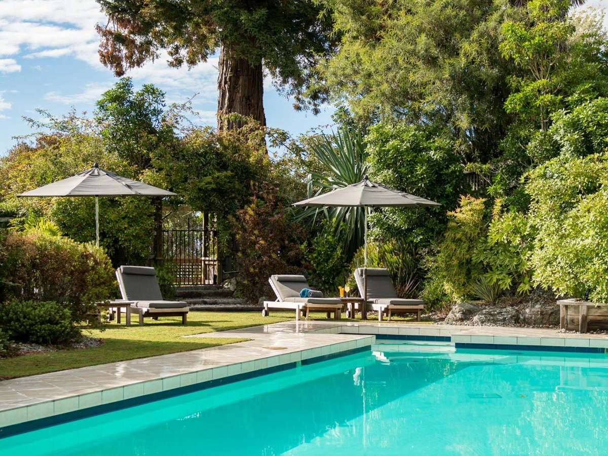Swimming pool and gardens at Te Koi The Lodge in New Zealand