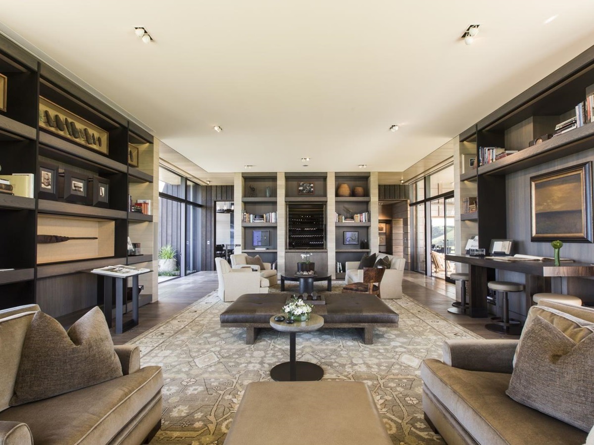 The Landing New Zealand Cooper Residence living area with bookshelves and sofas