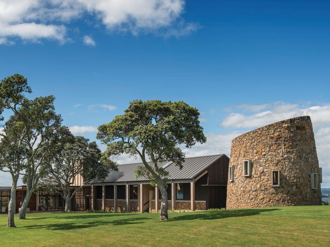 The Landing New Zealand Cooper Residence exterior view of the property with trees and ocean views