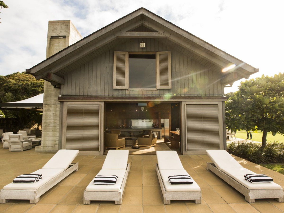 The Landing New Zealand The Boathouse loungers in front of the house