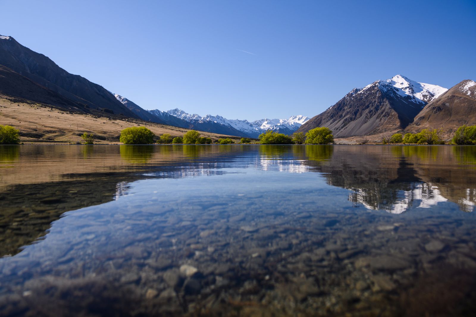 View of the Ahuiri River with mountains either side at The Lindis Lodge in New Zealand