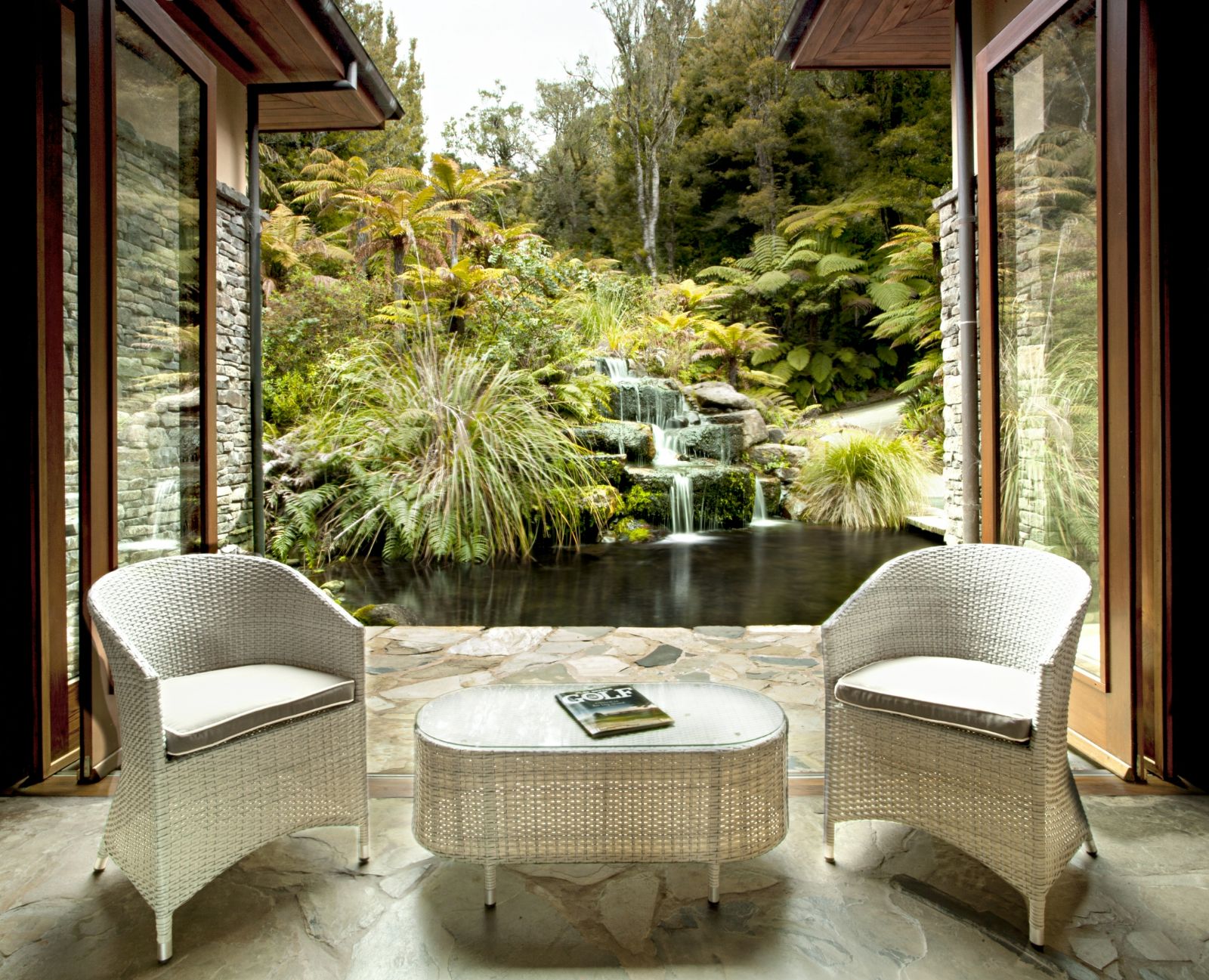 Great Room waterfall vie w at Treetops Lodge & Estate in Rotorua, New Zealand