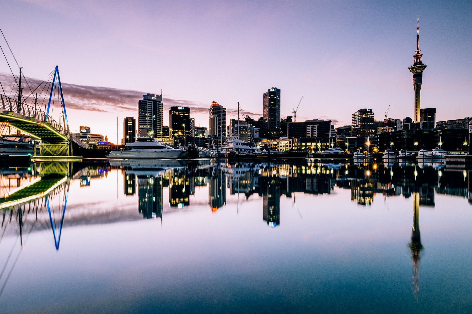 View of Auckland skyline from across the water at dusk
