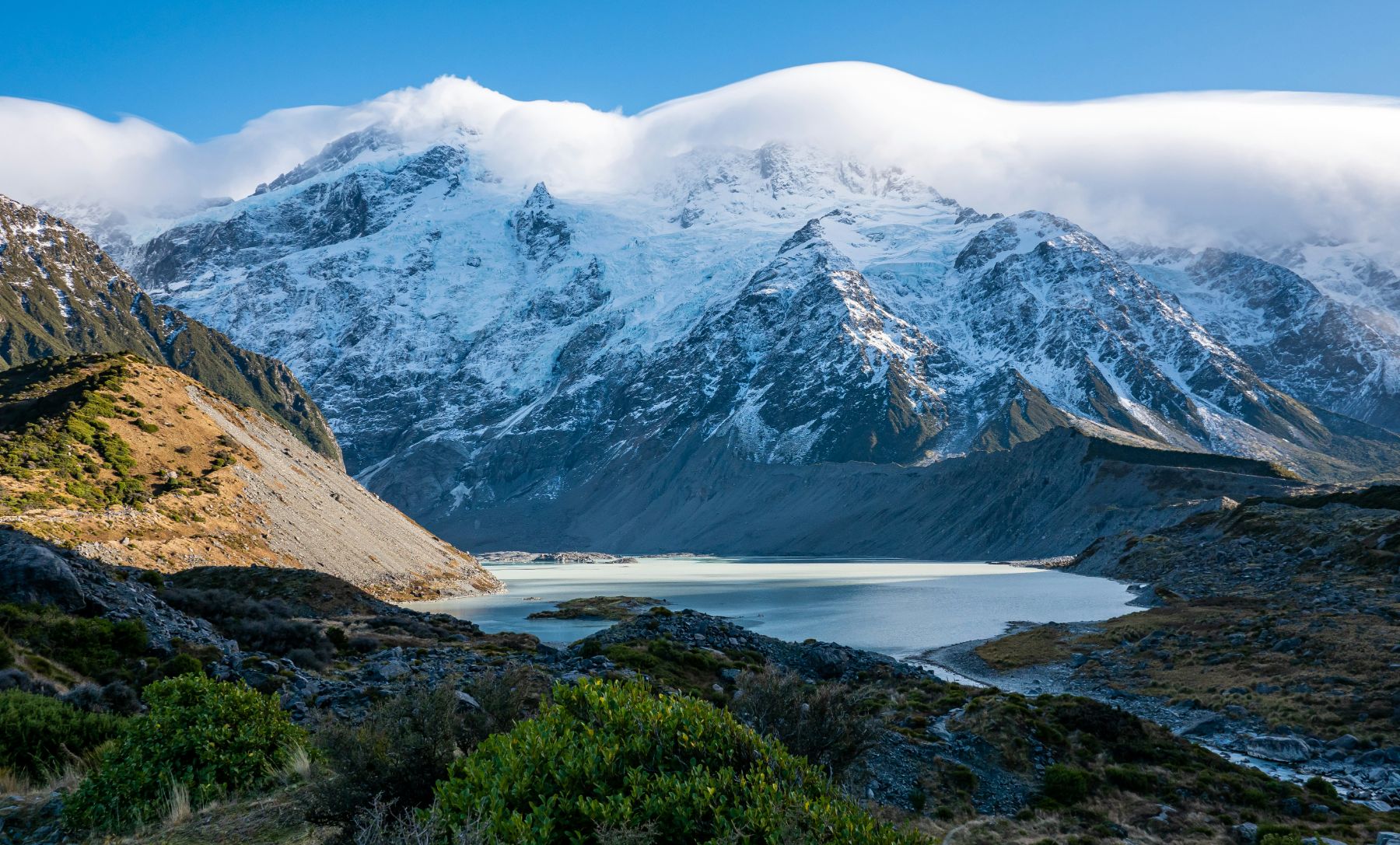 View of Mount Cook in New Zealand with mist over the snow-capped peak