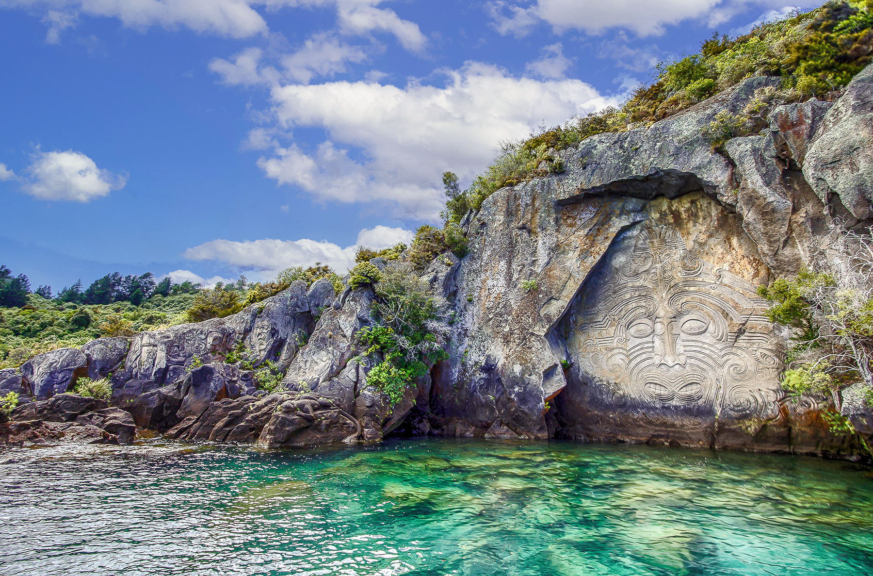 Rock carvings on a cliff face in Taupo on New Zealand's North Island