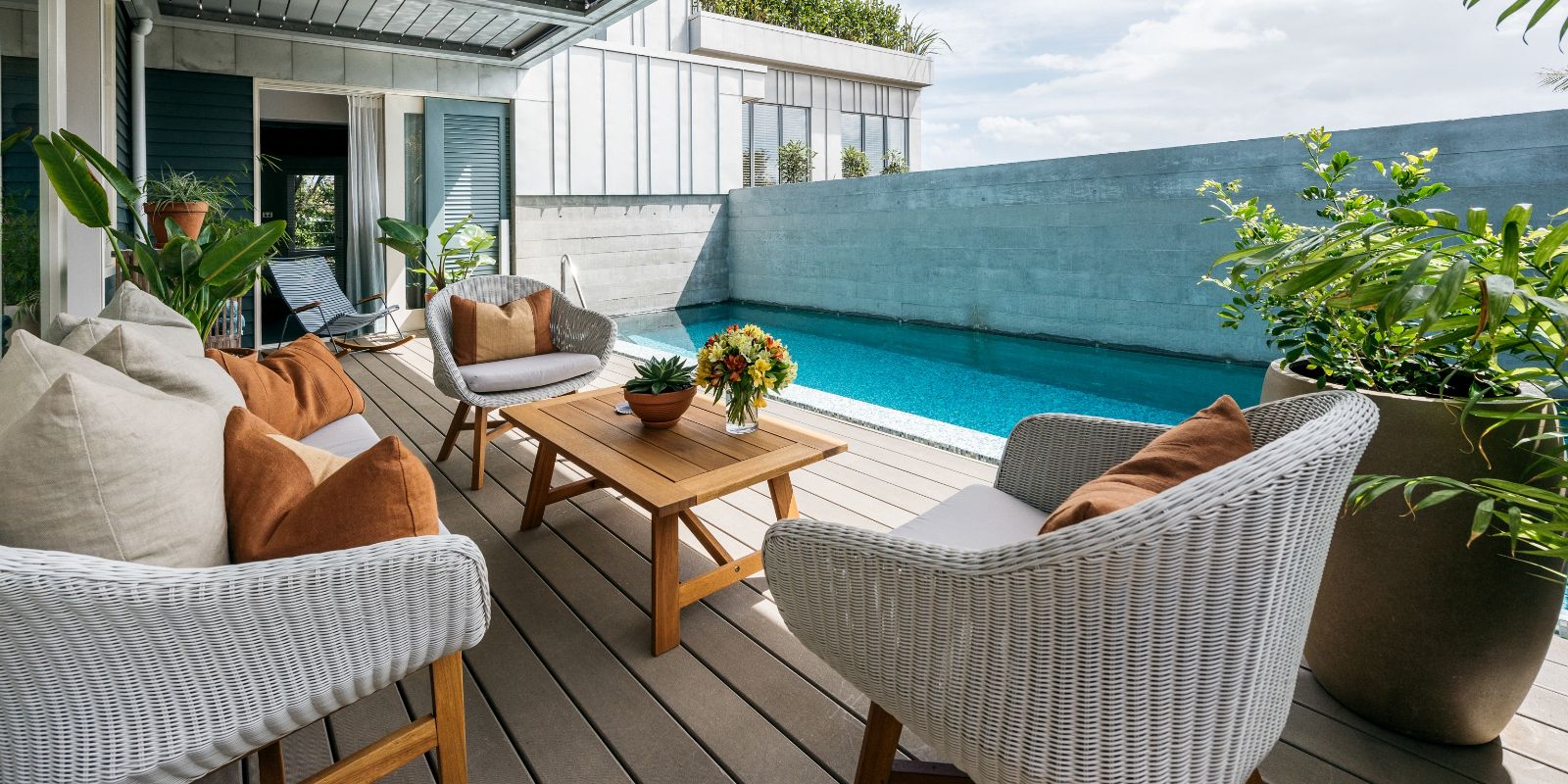 Outdoor dining area with outdoor pool at The Boatshed, Waiheke Island, New Zealand