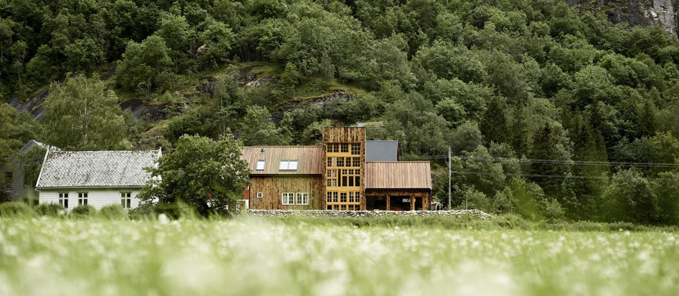 View of exterior from fields at 29-2 Aurland in Norway