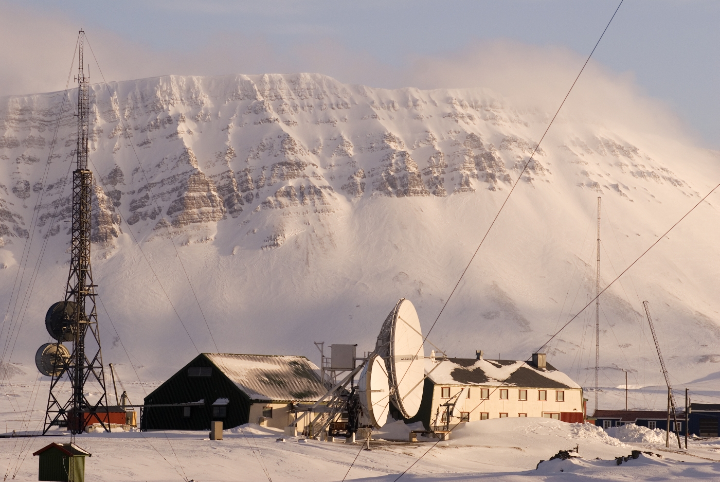Exterior view in daylight winter at Basecamp Explorer - Isfjord Radio Adventure Hotel in Svalbard Norway