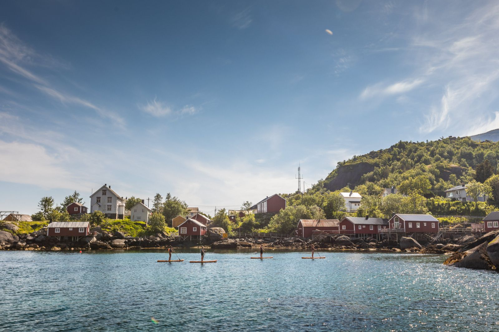 Paddle boarding on the grounds of Nusfjord Arctic Resort in Norway