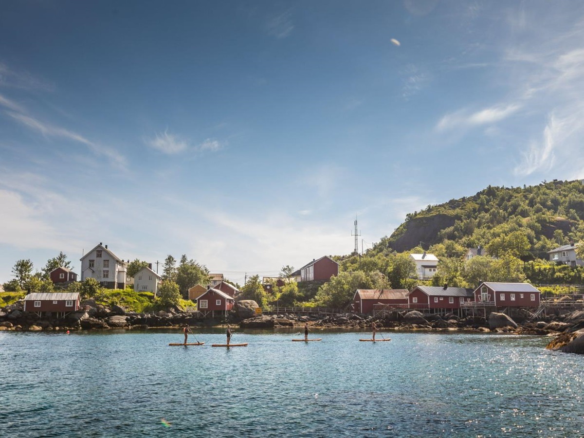Paddle boarding on the grounds of Nusfjord Arctic Resort in Norway