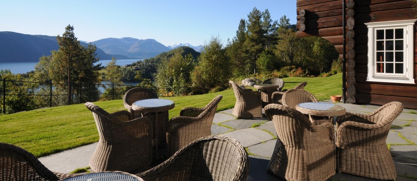 Open outdoor terrace with view of fjord at Storfjord Hotel in Norway