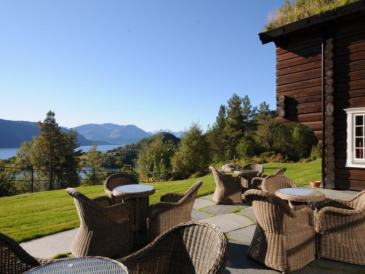 Open outdoor terrace with view of fjord at Storfjord Hotel in Norway
