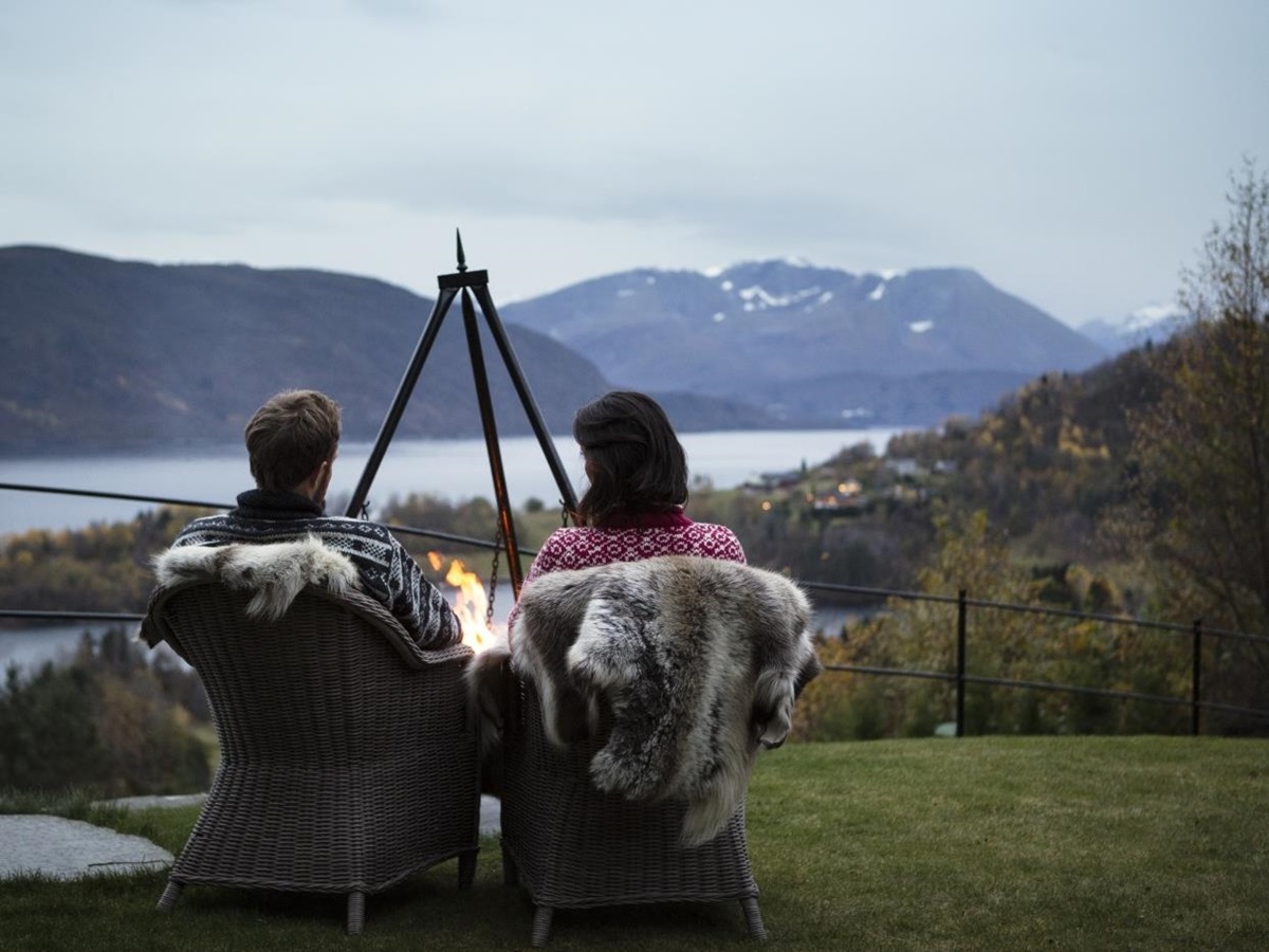 People enjoying the view at Storfjord Hotel in Norway
