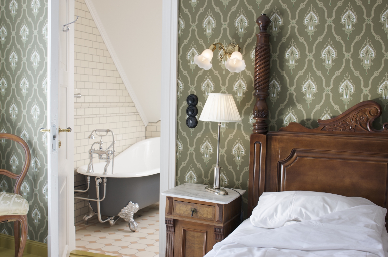Room and bathroom view in main building of Walaker Hotel in Norway