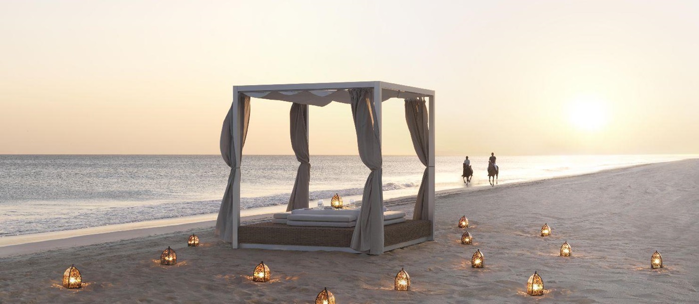 Private dining on the beach at the Al Baleed Salalah by Anantara resort in Oman