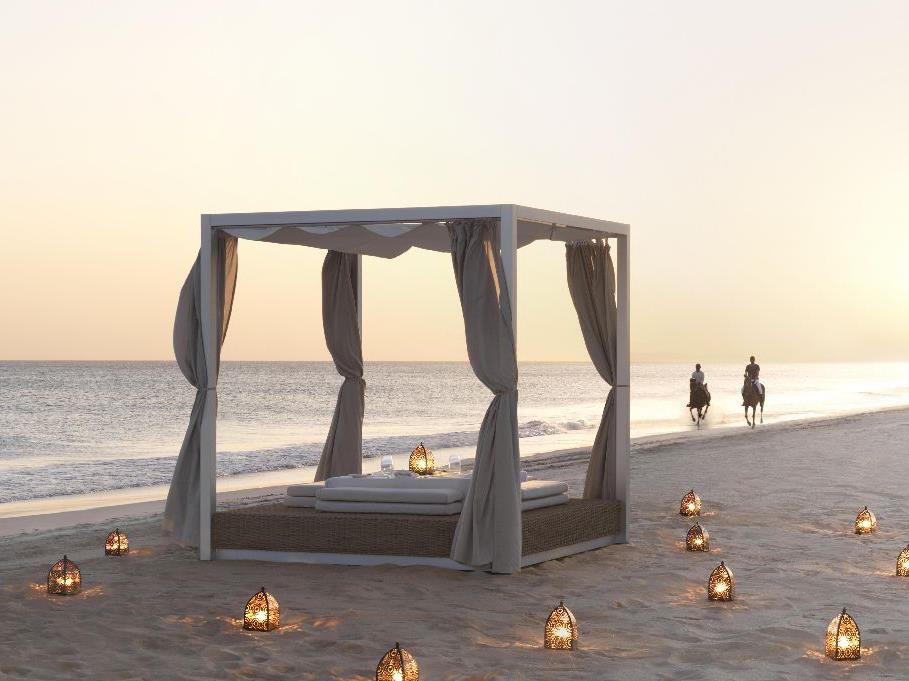 Private dining on the beach at the Al Baleed Salalah by Anantara resort in Oman