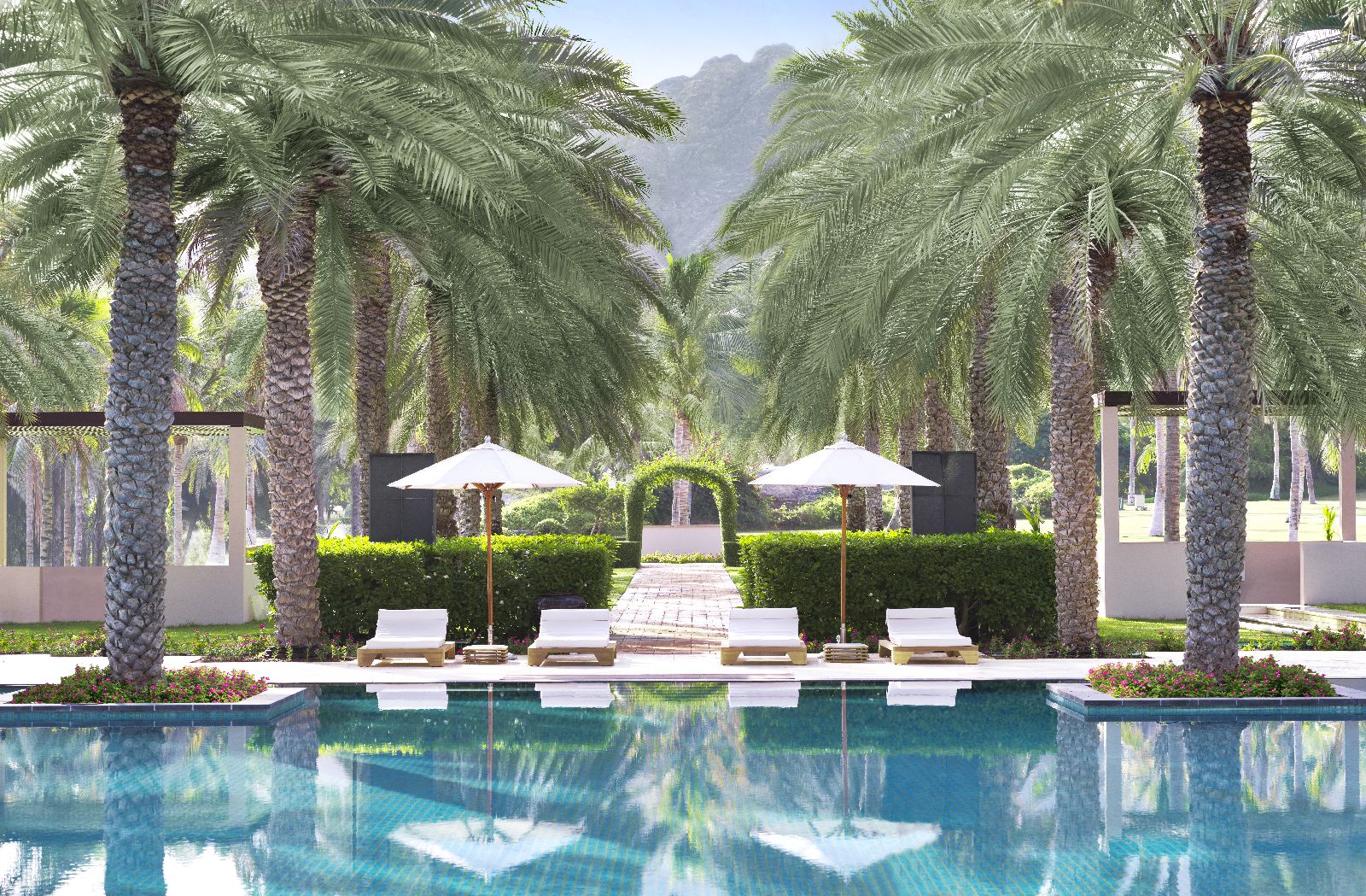 Swimming pool and gardens of the Al Bustan Palace Muscat Oman