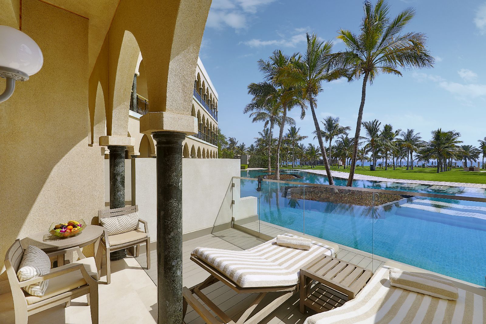 Terrace of a lagoon view room at the Al Bustan Palace Muscat Oman