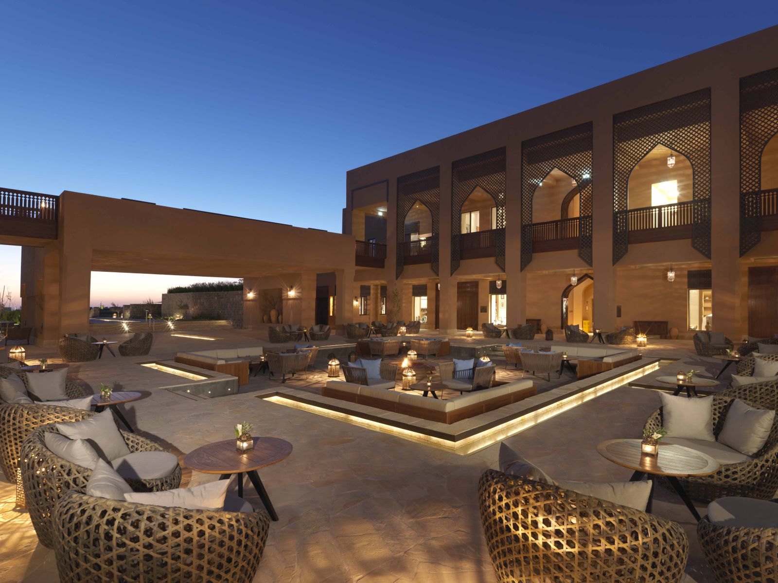 Wicker furniture on the courtyard patio at the Anantara Al Jabal Al Akhdar Resort in Oman