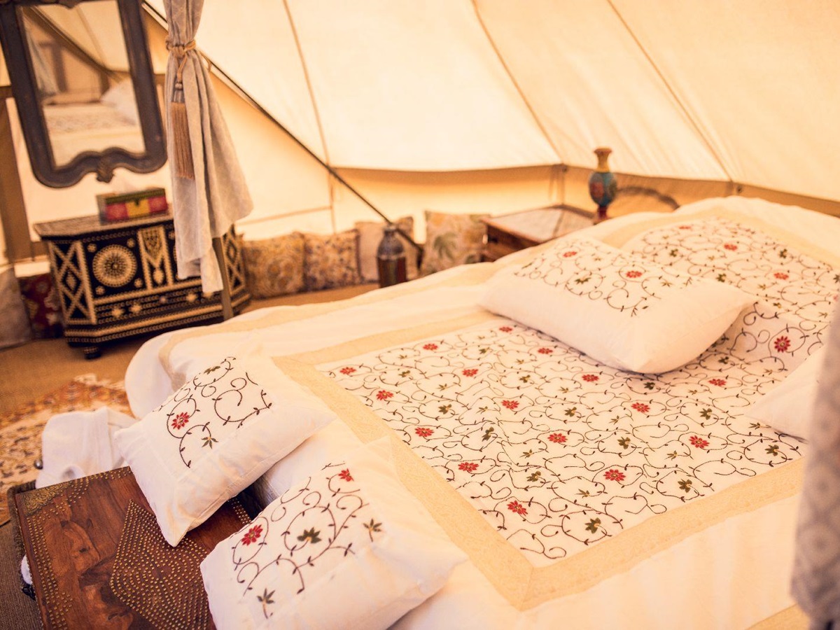 Comfortable bed in the Canvas Club tented camp in Oman
