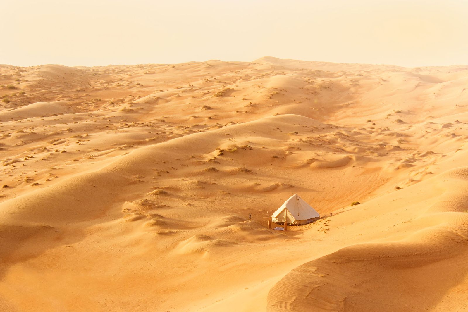 Distant view of the Canvas Club tented camp in the middle of the Oman desert