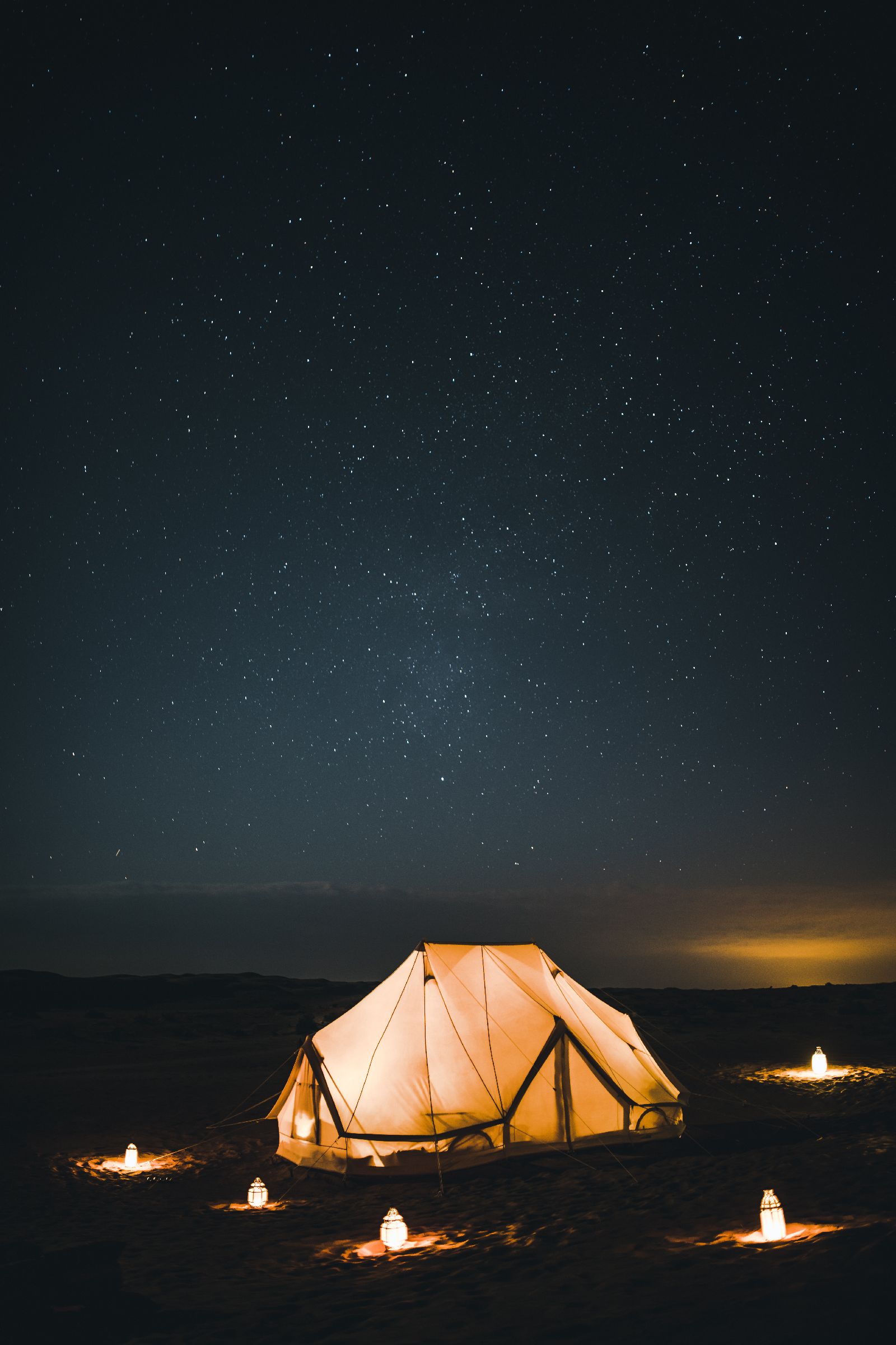 Bedouin tent at the Canvas Club luxury camp in Oman illuminatted by night
