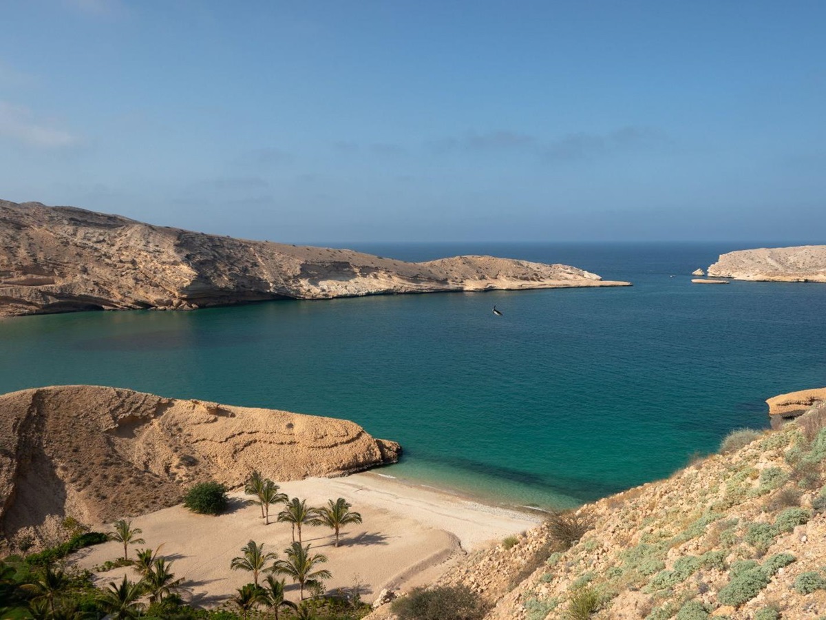 Aerial view of sandy beach and cove at Jumeirah Muscat Bay in Oman