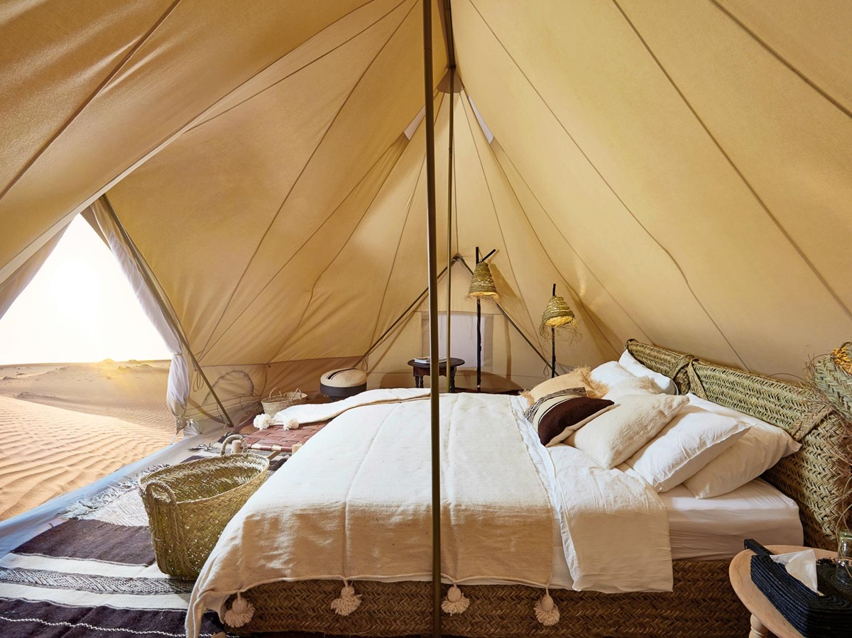Bed in a guest tent at Magic Camps Wahiba Sands in the Sharqiya Sands in Oman