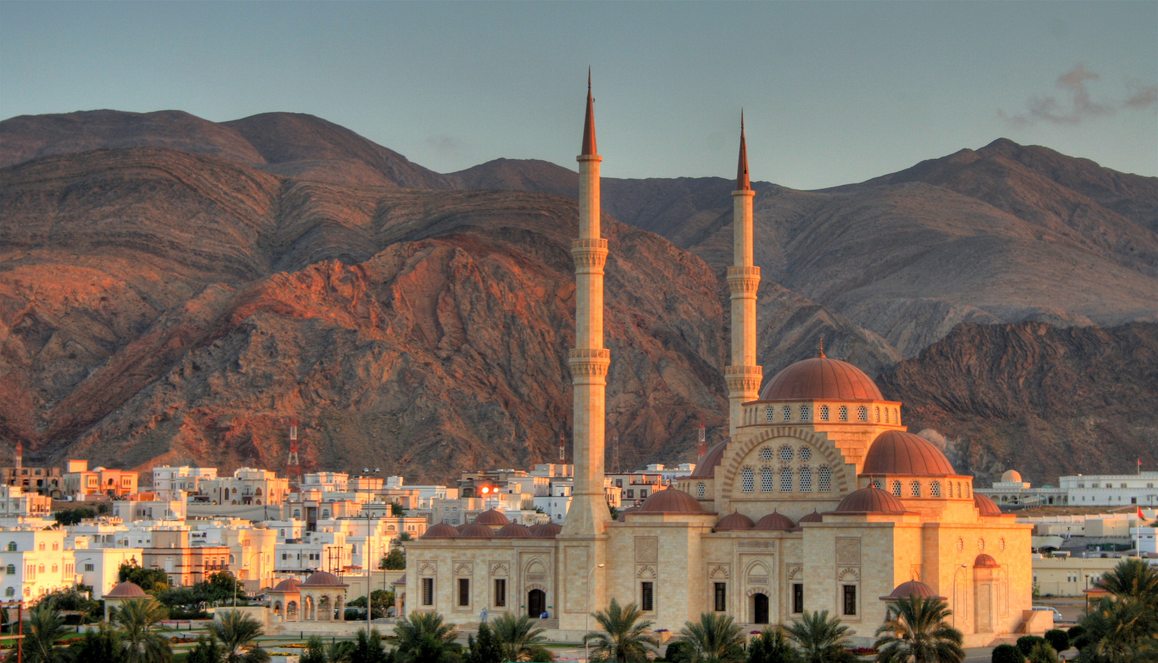 View of the Grand Mosque and mountain backdrop in Muscat, Oman