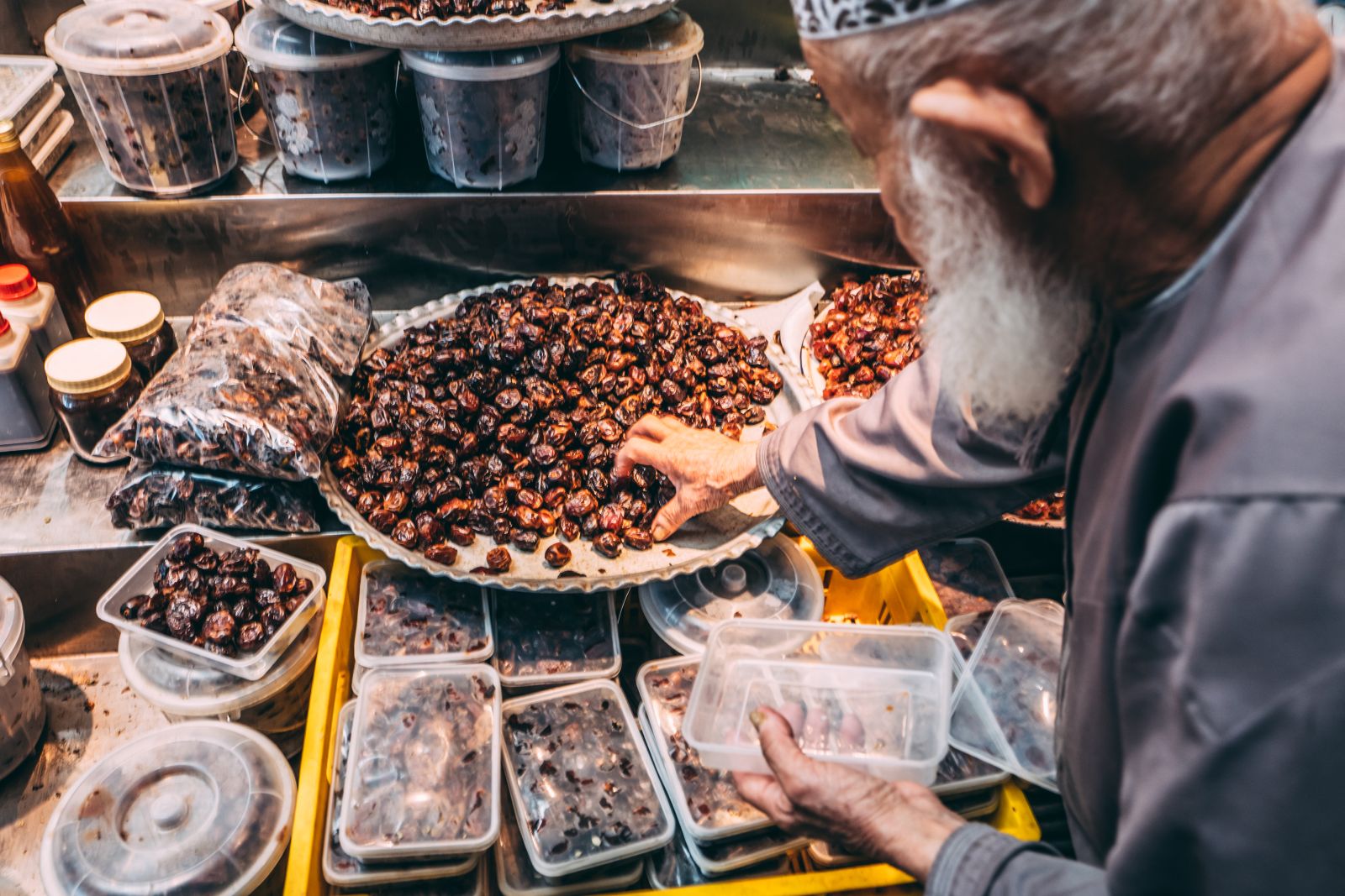 Local man buying dates in a souk in Oman