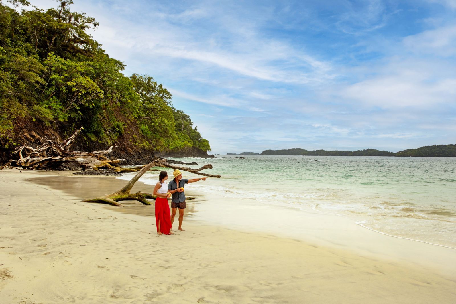 Couple walking on a deserted beach in Islas Secas Panama