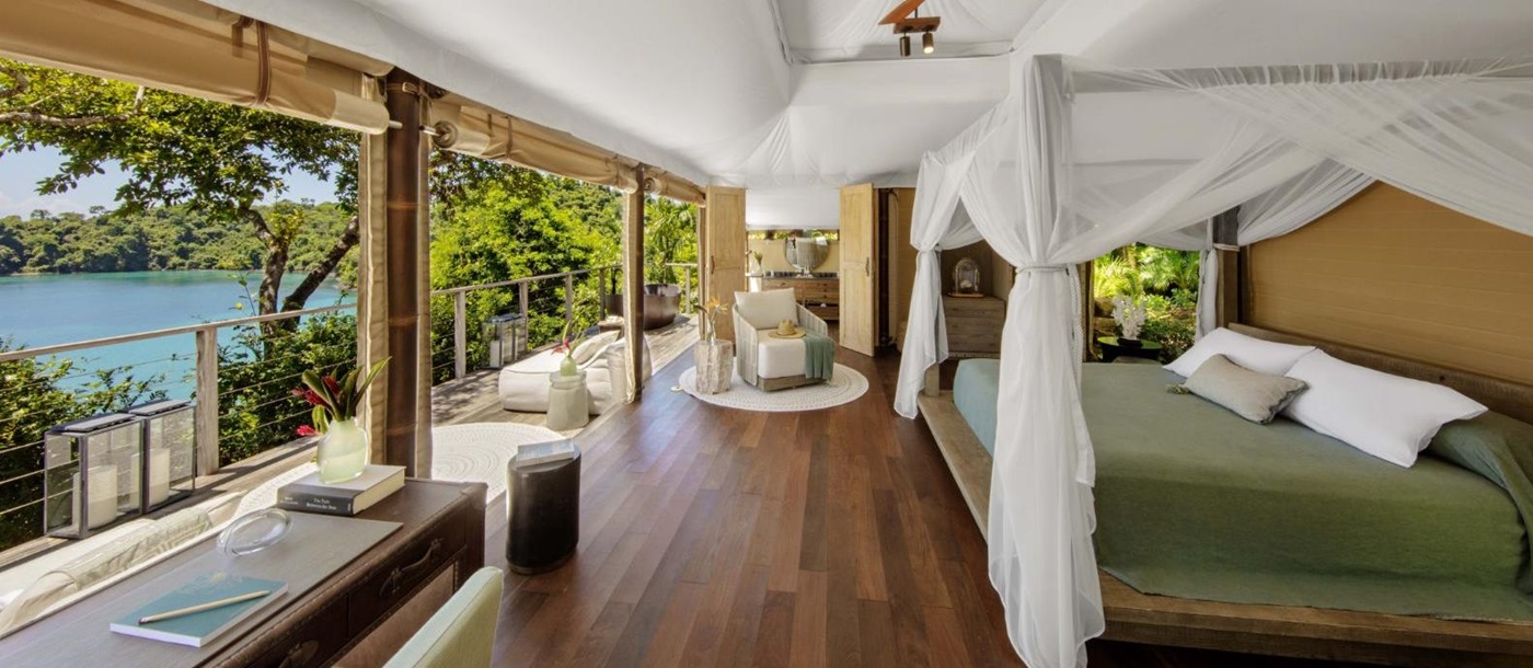 A tented guest suite bedroom at Islas Secas resort in Panama