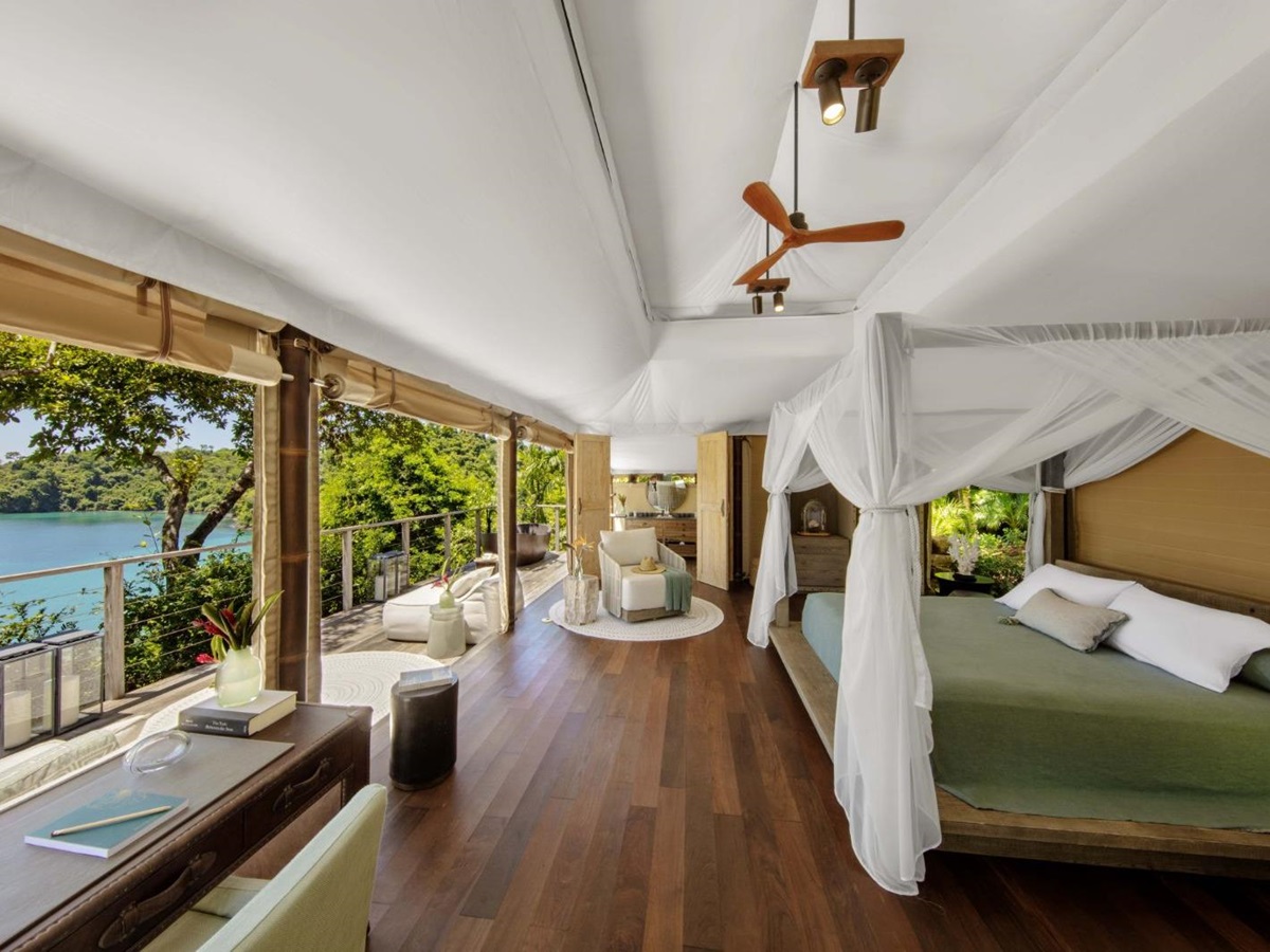 A tented guest suite bedroom at Islas Secas resort in Panama