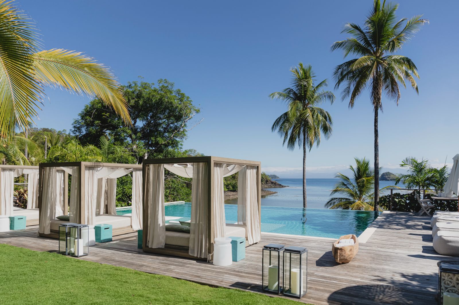 Poolside sunbeds with ocean views at Islas Secas resort in Panama