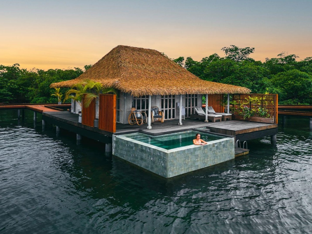 Exterior view of guest suite villa at sunset at Nayara Bocas Del Toro resort in Panama