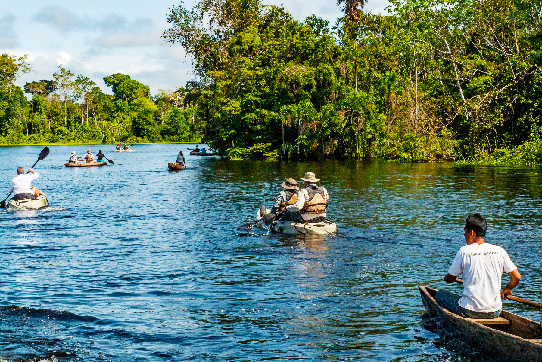 Guests of the Aqua Nera river cruiser canoeing on the Peruvian Amazon